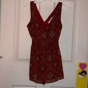 Red patterned cross v-neck and stomach sinched tank top